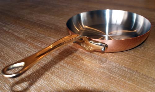 solid copper skillet lined with stainless steel