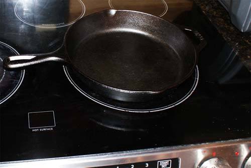 cast iron cookware on glass top stove